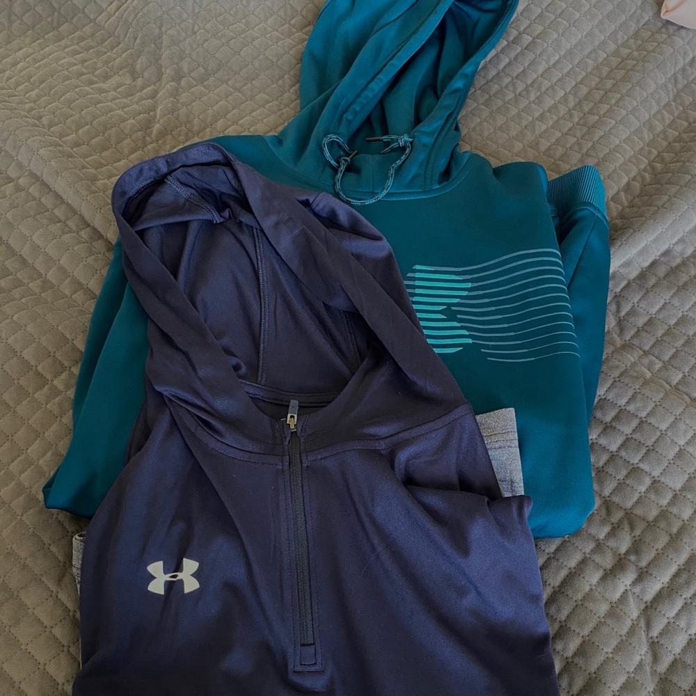 Pair of UA pullovers